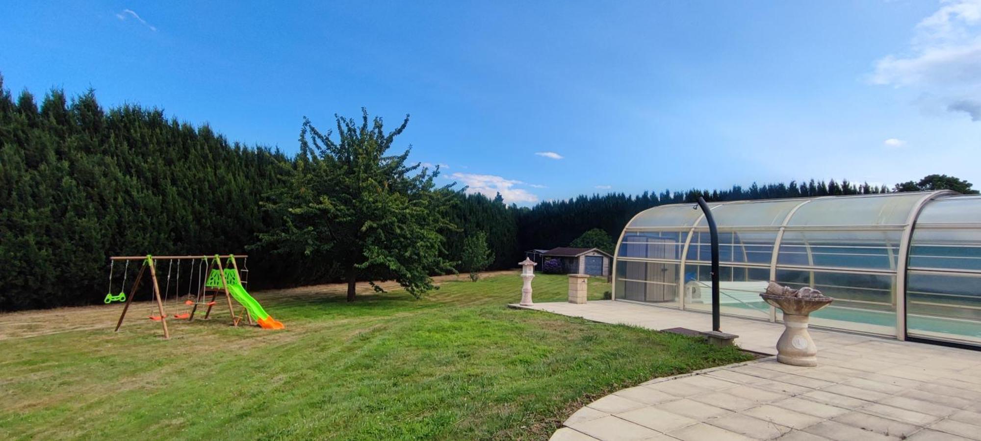 With Covered And Heated Swimming Pool